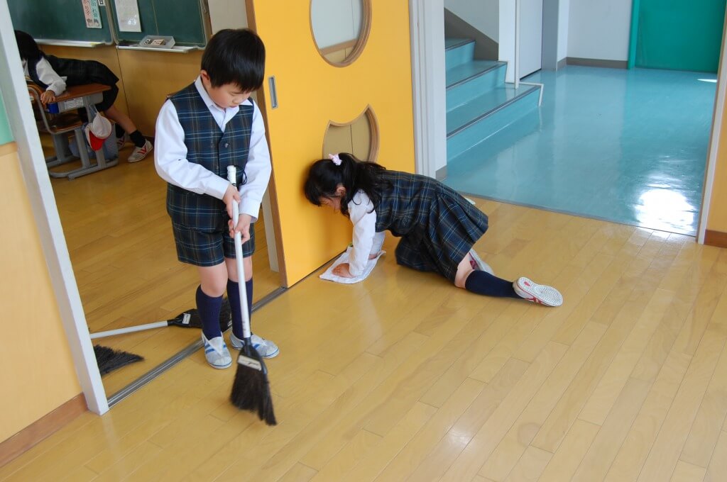 Children cleaning the school corridors and classes in Japan.